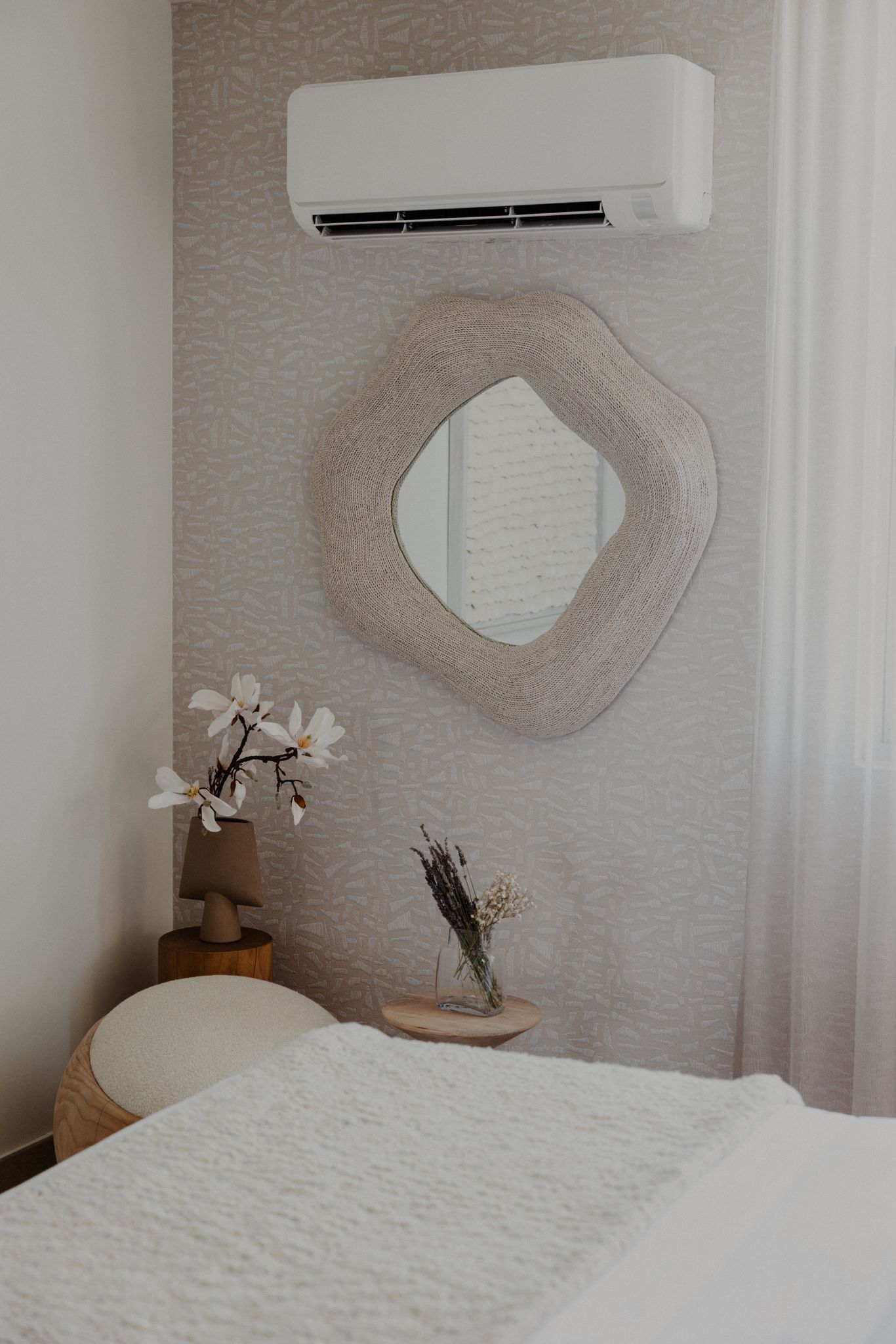 Primary bedroom with linen headboard.
